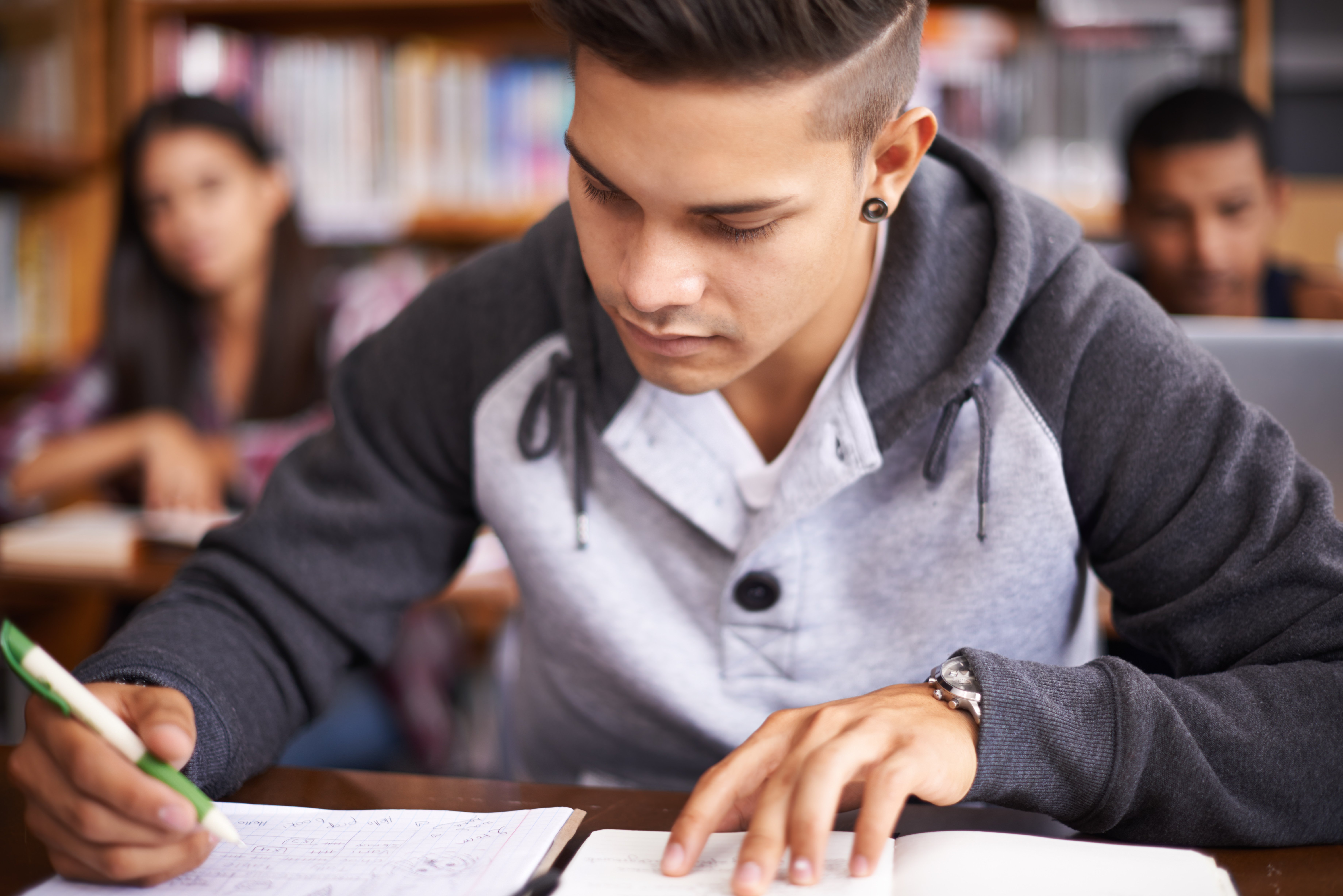 Young man writing