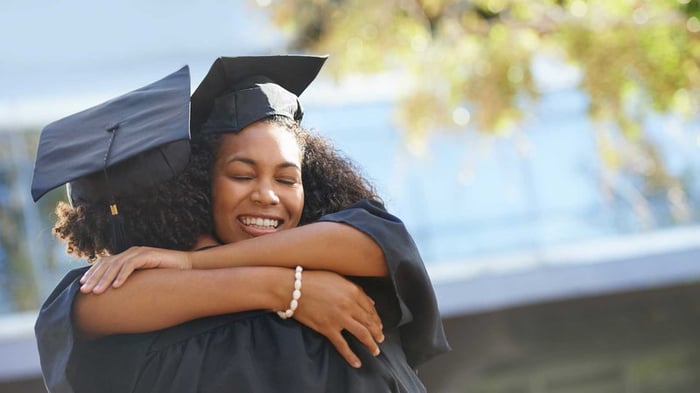 Mother and daughter hugging during graduation ceremony