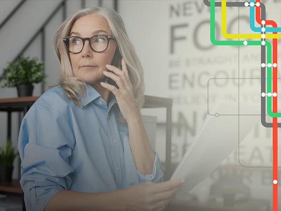 Woman works from home while talking on a cell phone