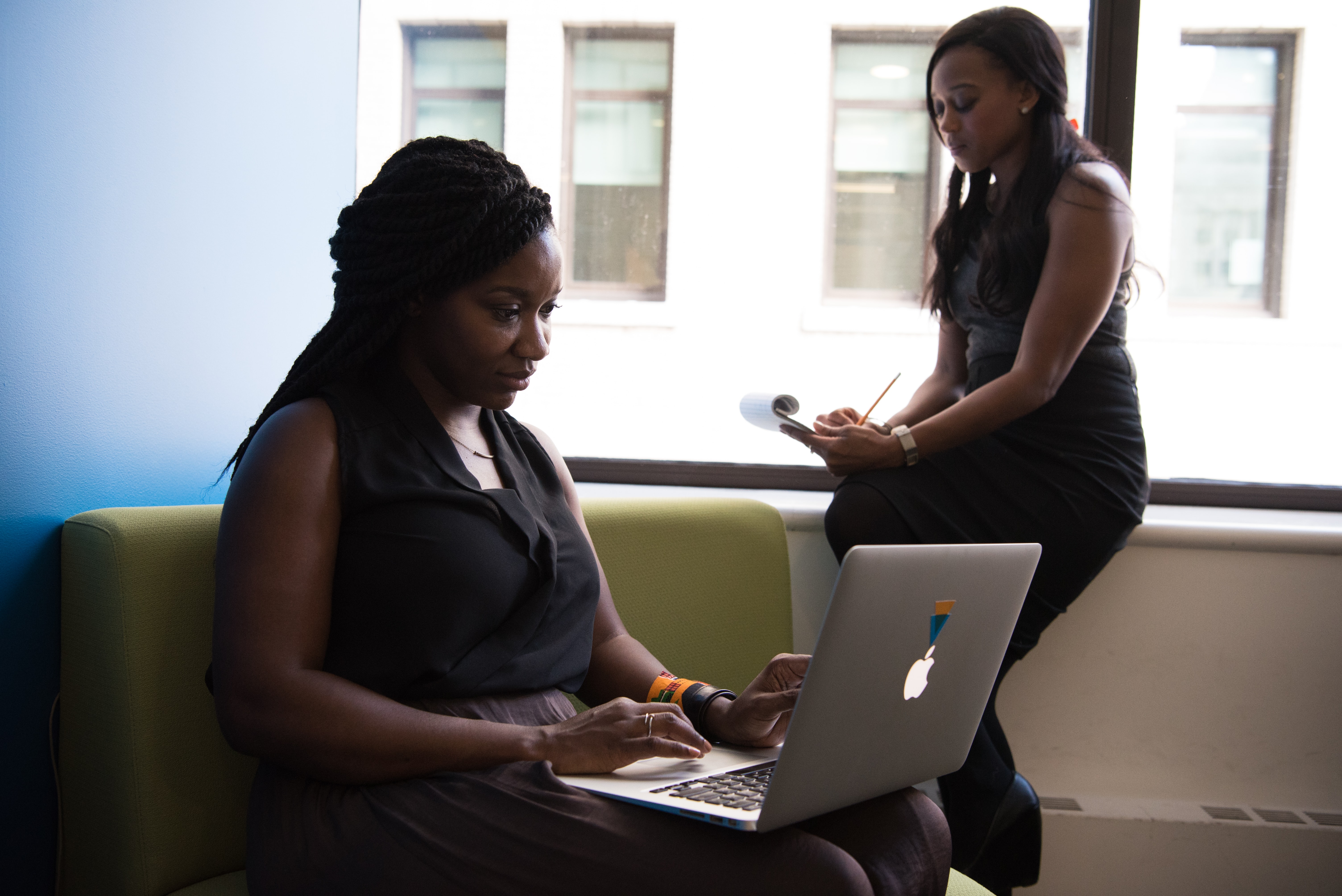 Two women working together in an office environment
