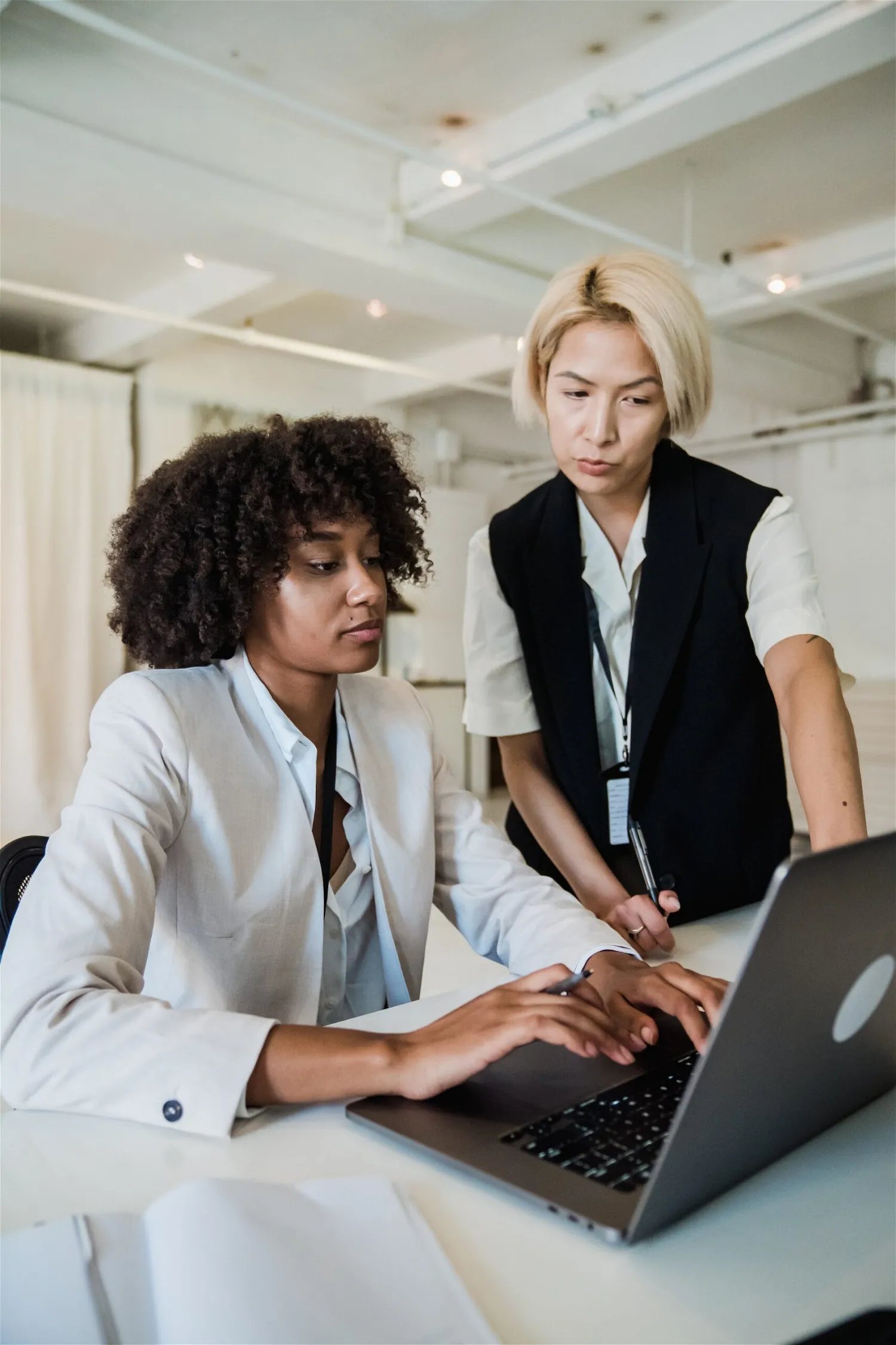 Image of 2 people looking at computer