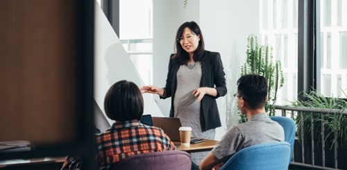 corporate leaders and workers collaborating