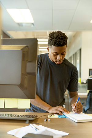 Black man working at computer